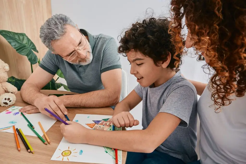child in Edmonton working with a therapist